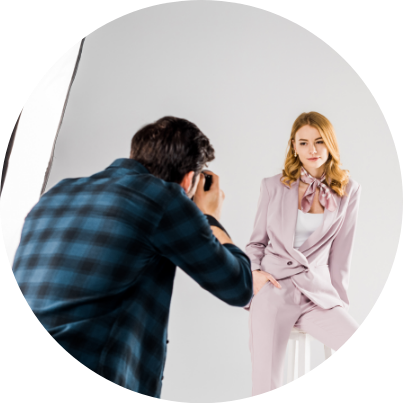 A woman posing for a photo in a studio.